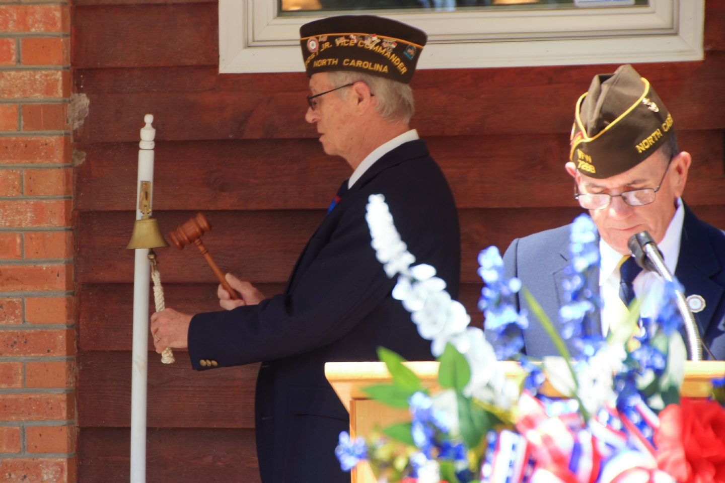 Calabash VFW Post 7288 Chaplain George Bissett tolls the bell in memory of members who passed in 2021 as commander Jim Milstead reads the roll.